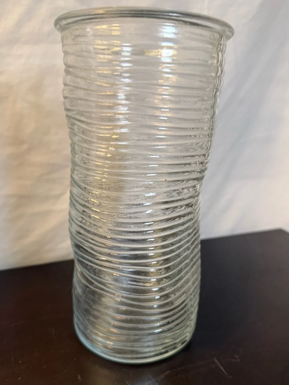 Ribbed glass vase, wavy, pinched shape. Mid-Century Modern design. 9.75”